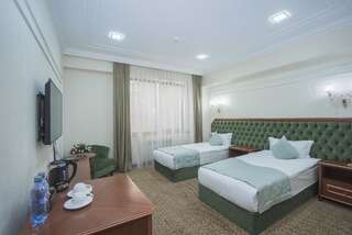 Отель Plaza Hotel Almaty Алматы Стандартный двухместный номер с 2 отдельными кроватями-1